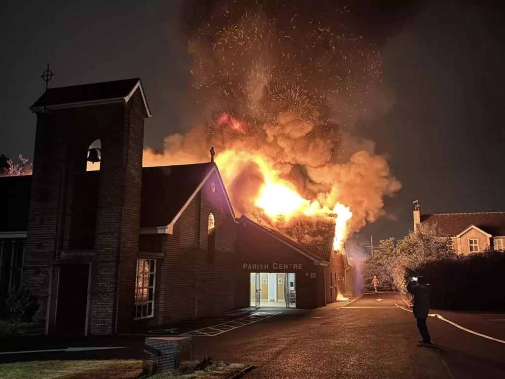 Through the window of the nearby Baptist church, where the Anglican church building was destroyed by fire, was where last night's service was held.